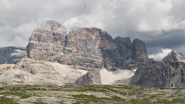 The rocky wall of the Croda dei Toni (or Zwolferkofel) (3094 m), a peak of the Sexten Dolomites on the border between the provinces South Tyrol and Belluno, Italy.