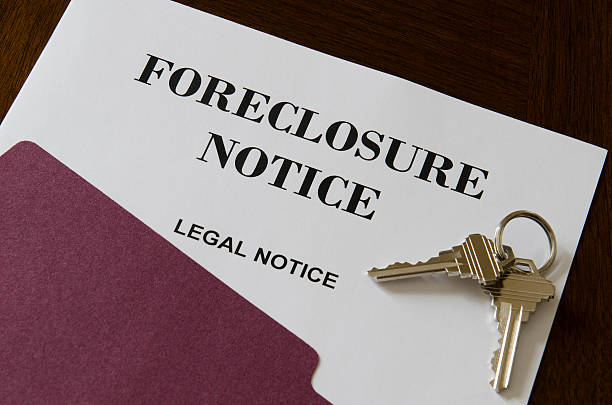 Real Estate Home Foreclosure Legal Notice and Keys Real Estate Home Foreclosure Legal Notice And Keys foreclosure stock pictures, royalty-free photos & images