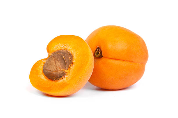 два спелых абрикос сечение, нож - apricot portion antioxidant fruit стоковые фото и изображения