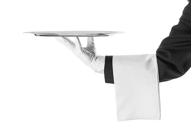 A black and white photo of a waiter holding a platter Waiter with a silver plate .Isolated on a white background formal glove stock pictures, royalty-free photos & images