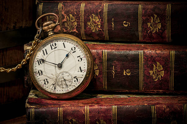 istock Old pocket watch and books in Low-key copy space 177362925