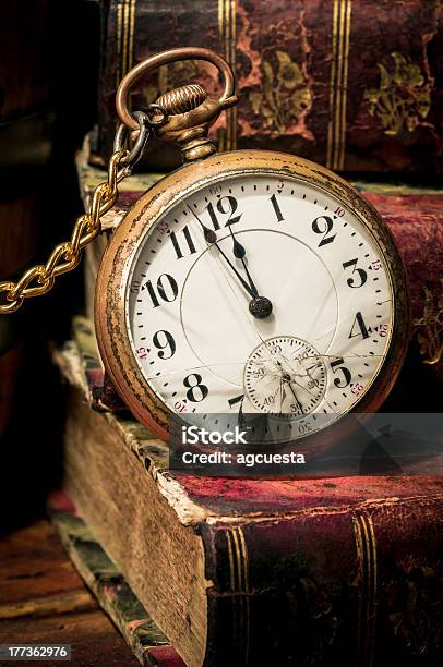 Old Pocket Watch And Books In Lowkey Stock Photo - Download Image Now - 12 O'Clock, Aging Process, Antique