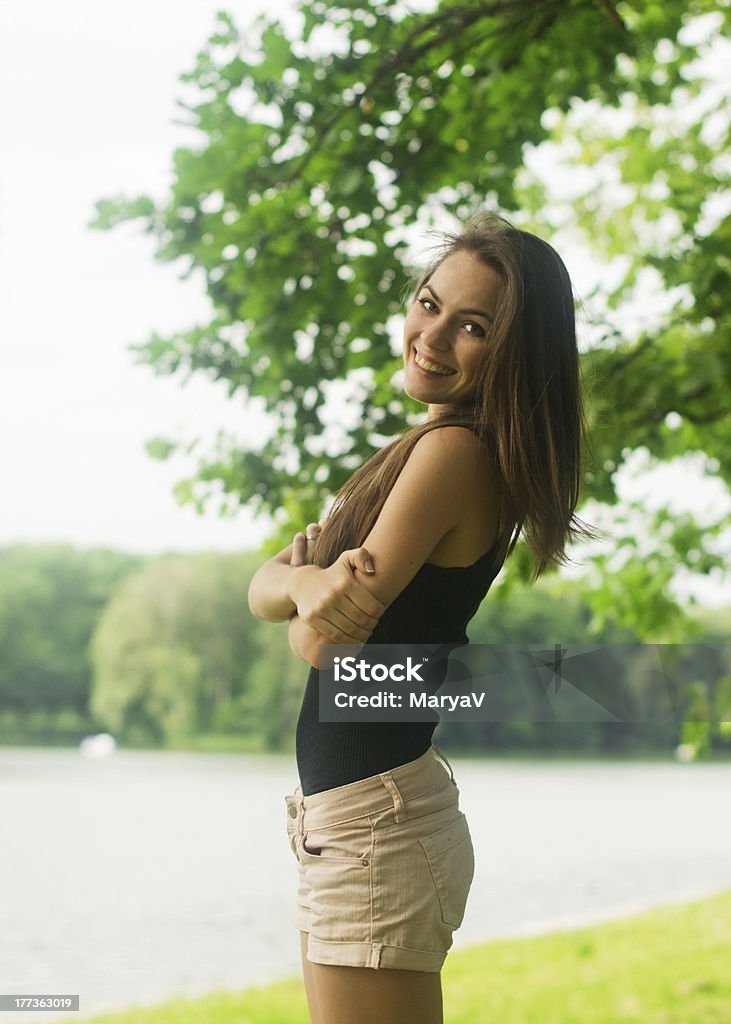 Happy young woman Portrait of attractive happy young woman, outdoors. 18-19 Years Stock Photo