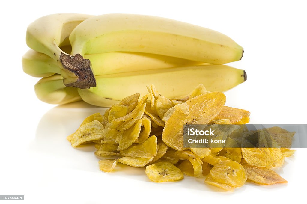 Banana Chips Banana chips and bananas studio isolated on white background Banana Stock Photo