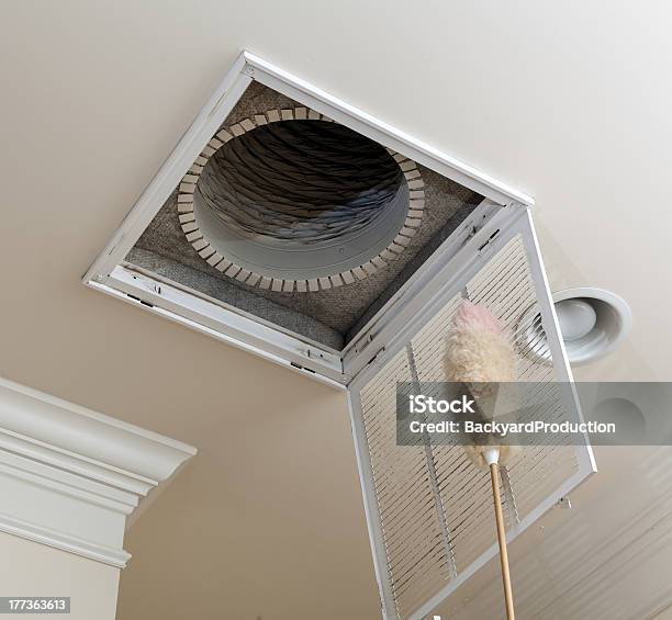 Senior Man Opening Air Conditioning Filter In Ceiling Stock Photo - Download Image Now