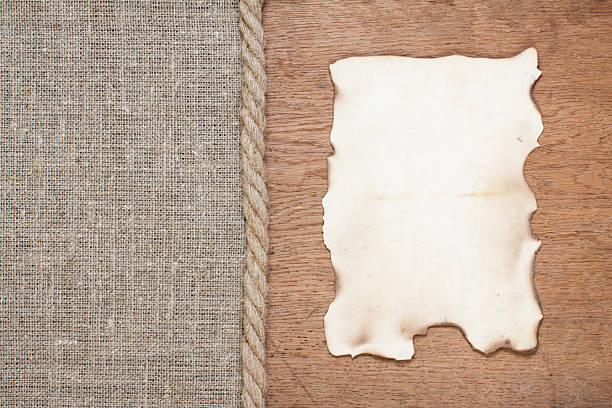 istock Burnt paper on oak wood and canvas 177363936