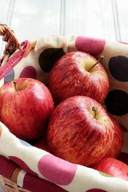 Fresh red apples in a basket stock photo