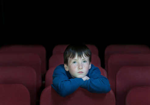 children in retro cinema watch movie