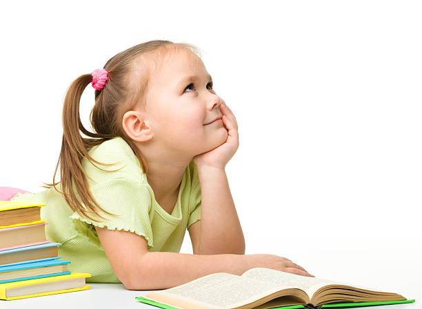 Cute little girl with books stock photo