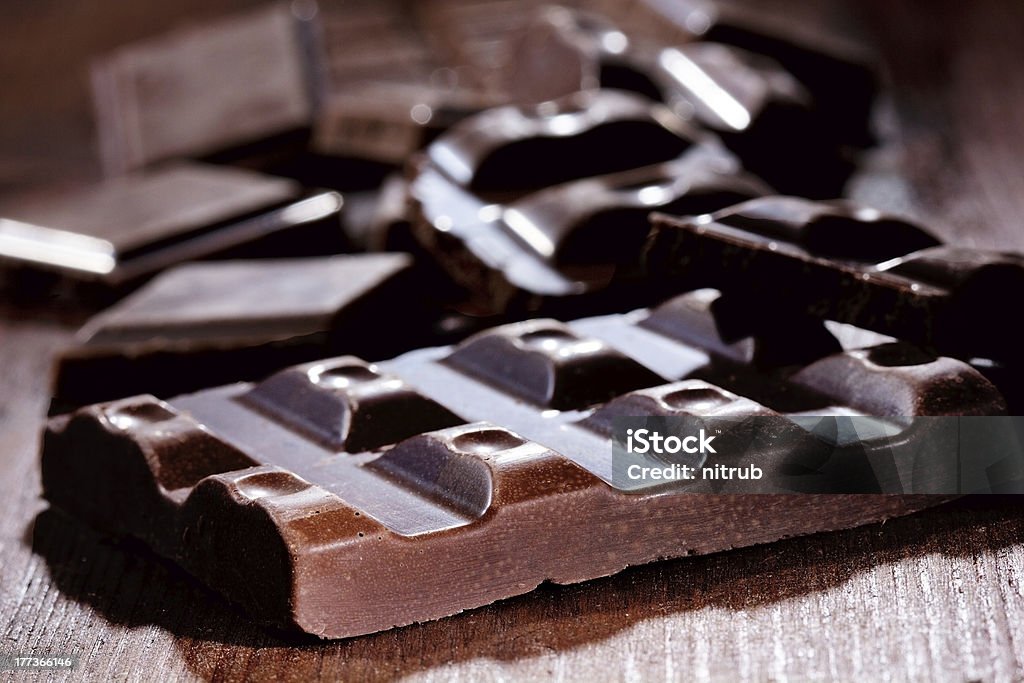 Chocolate pieces Chocolate pieces on wooden table Brown Stock Photo