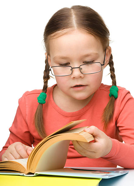 istock Cute little girl reading book 177366189