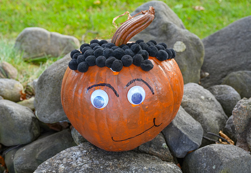 Halloween pumpkin craft outdoor on the ground
