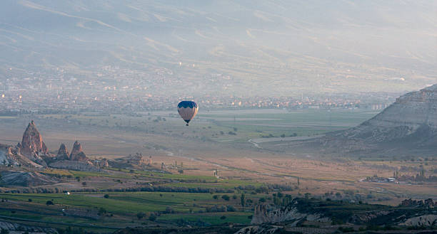 istock Hot air balloons rise over valley, Turkey 177368420