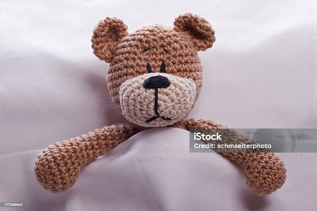 teddy bear lyiing sick in bed brown teddy bear lyiing sick in bed Animal Stock Photo