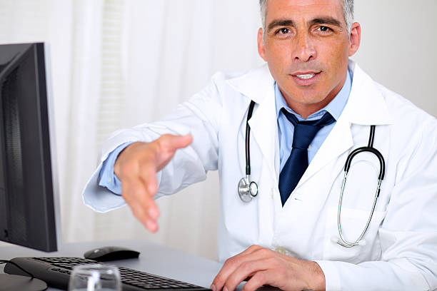 istock Senior trustworthy doctor greeting 177369321
