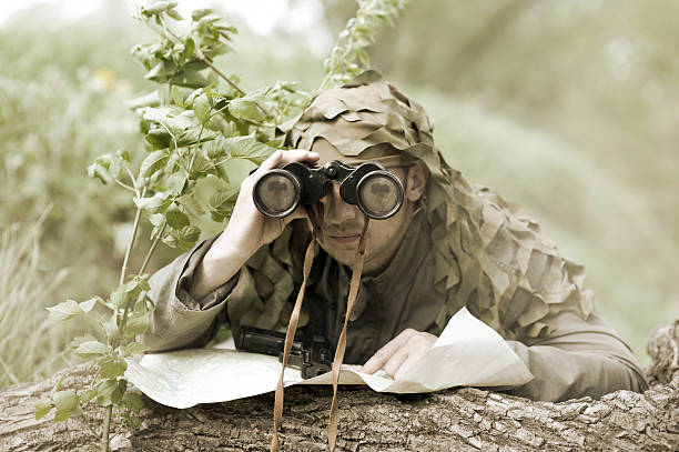 Military Camouflaged man stock photo