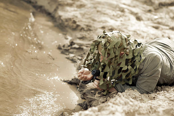 Military Camouflaged man stock photo