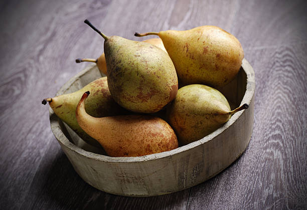 istock pears in wooden bowl 177369716