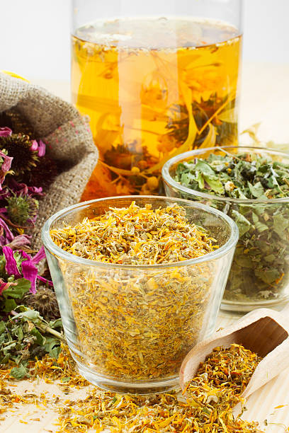 istock healing herbs and healthy tea on wooden table 177370290