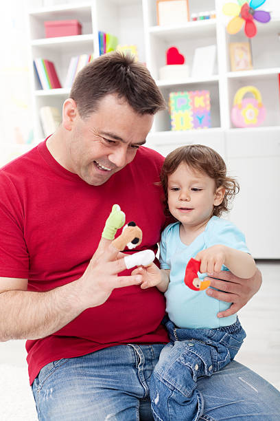 istock Toddler boy playing with his father 177370423