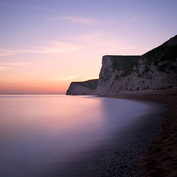 istock Bat's Hole stone arch at sunset, Dorset UK 177370747