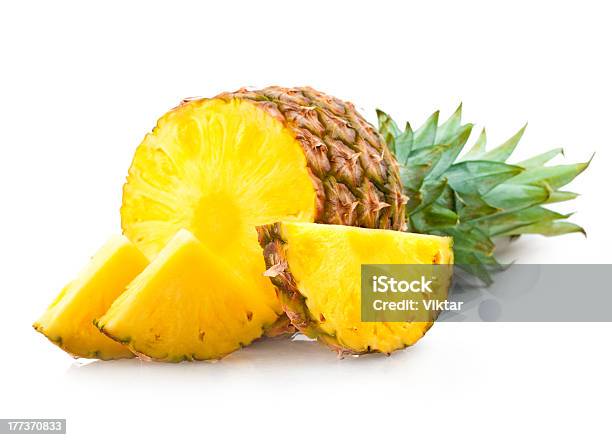 The Top Of A Pineapple And Three Slices Stock Photo - Download Image Now - Cut Out, Food, Food and Drink