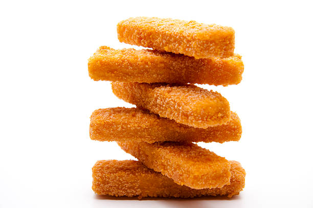 Fish sticks stacked Fish sticks stacked and on white background fish stick stock pictures, royalty-free photos & images