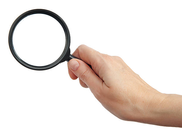 istock Woman hand with magnifier 177371187