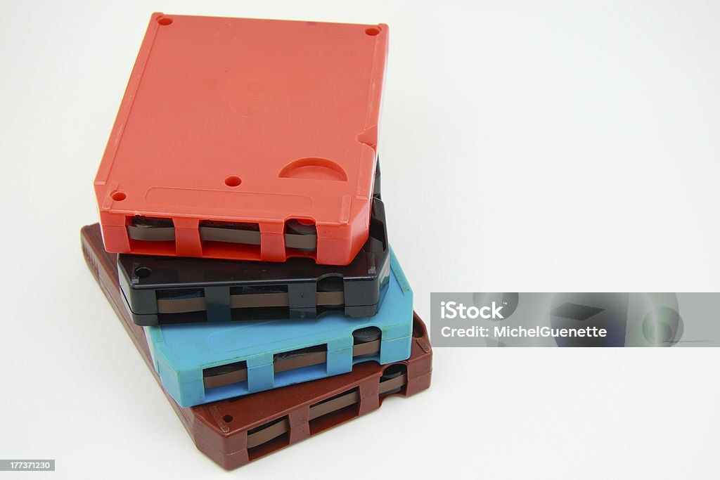 8-tracks audio tapes "Obsolete 8-tracks audio tapes, 4 different colors isolated on white" 8-track Stock Photo
