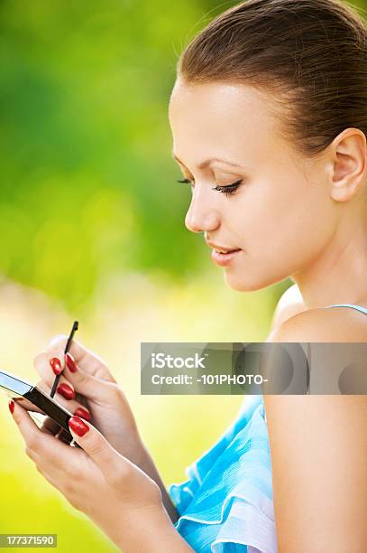 Portrait Of Young Woman Working With Smartphone Stock Photo - Download Image Now - Adult, Adults Only, Beautiful People
