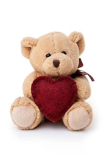 Toys: teddy bear holding red heart stock photo