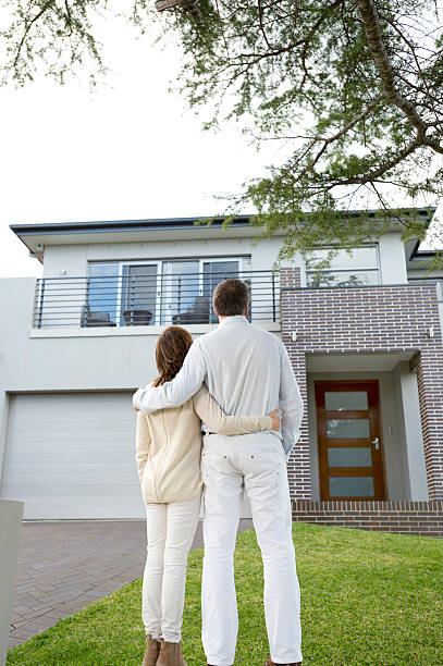 istock Mature couple looking at a house 177372407