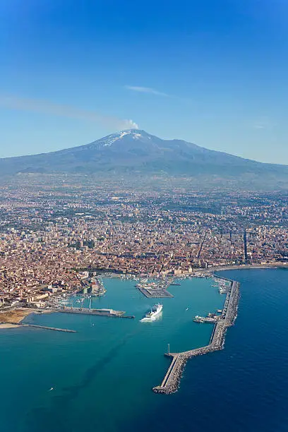 Bird's eye view of Catania city in Sicily with the Etna Vulcan in the back.