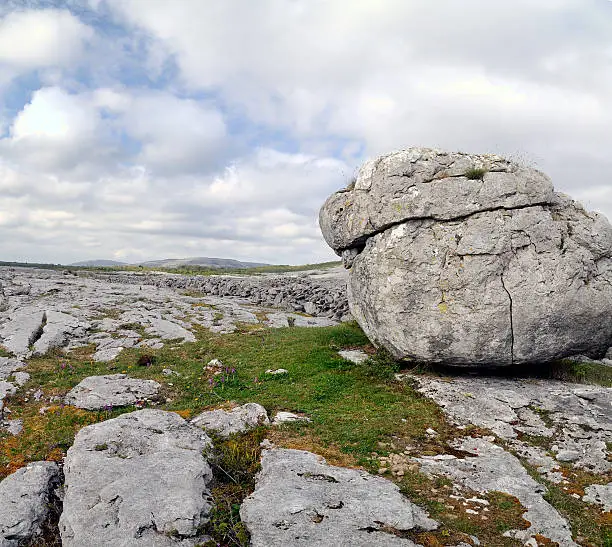 "The Burren is a karst-landscape regionin northwest County Clare, in Ireland. Boulders."