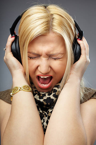 istock Young lady with headphones shouting or singing on a song 177373149