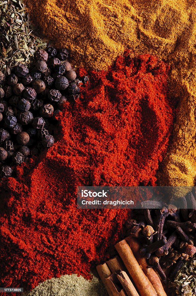 Spice background Spice background with different colored spices Backgrounds Stock Photo