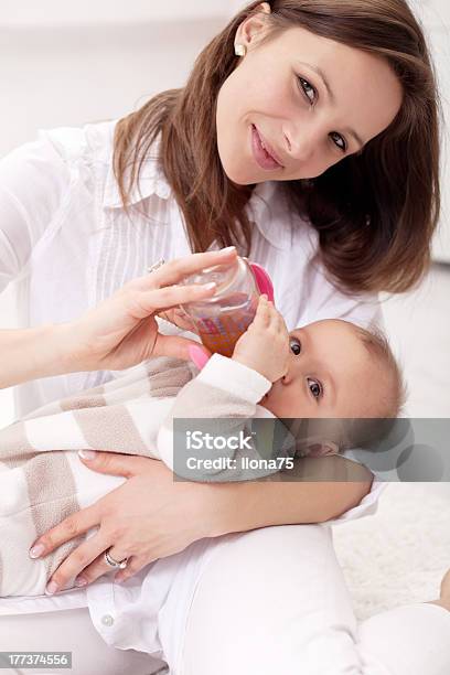 Baby Girl Held By Her Mother Stock Photo - Download Image Now - Tea - Hot Drink, Baby - Human Age, Drinking