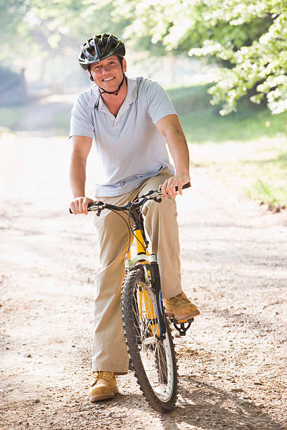 istock Man outdoors on bike smiling 177374647
