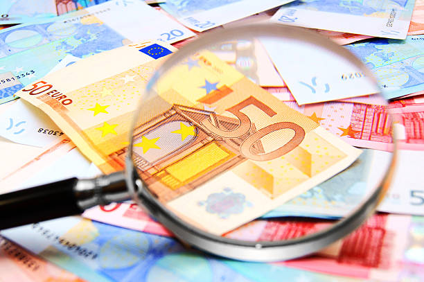 istock Money and magnifier. 177374758