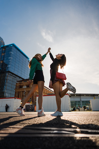 Two young friends enjoying a day outdoors, having fun at weekend.