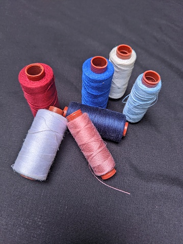 these are several different colored sewing threads