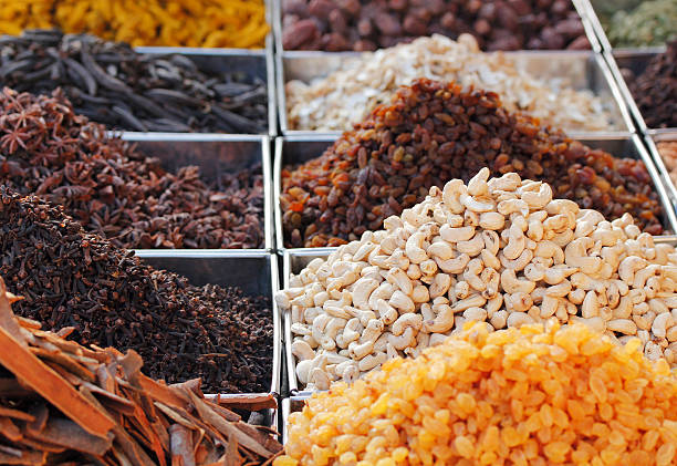 Dry fruits & spices displayed for sale in a bazaar stock photo