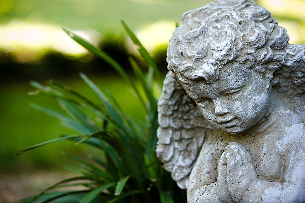 istock Angel Statue in Garden 177375686