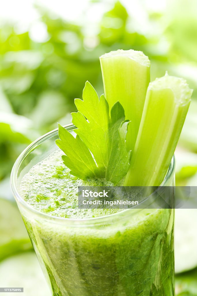 Photograph of green smoothie with celery Green vegetable smoothie with celery and cucumber. Blended Drink Stock Photo