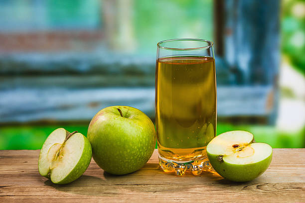 istock Apple juice in a glass on  table 177375917