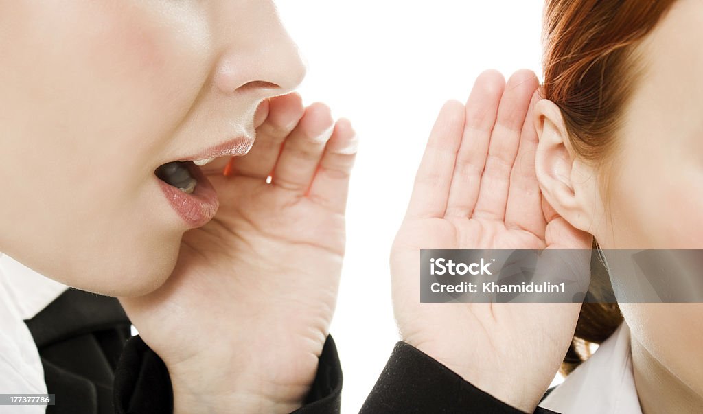 woman said and women listening to gossip isolated Woman said and woman listening to gossip isolated on the white background Adult Stock Photo