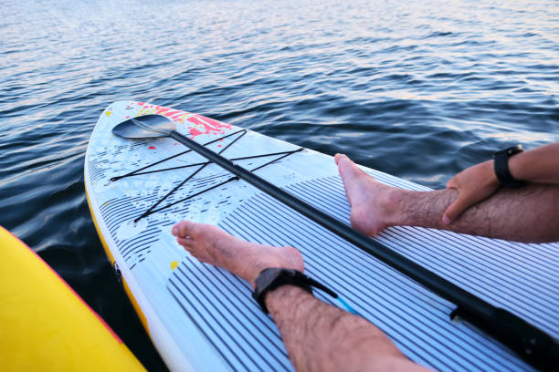 istock Male legs on a paddle board. 1773783726