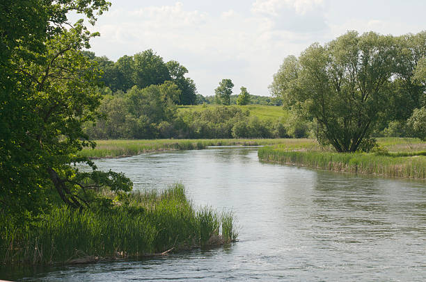 istock River Running Through Verdant Farm Land 177379530