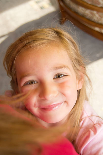 girl hugging her mom stock photo