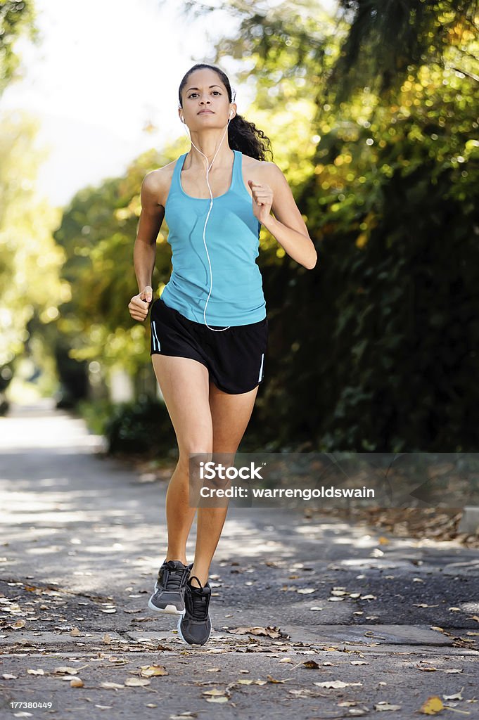 runner running running healthy fitness woman training for marathon outdoors in alleyway. vitality lifestyle run 20-29 Years Stock Photo